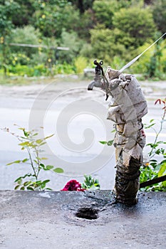 A tightly wrapped water valve and a dry pool.