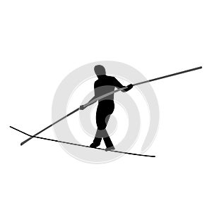 Tightrope walker balancing with a pole