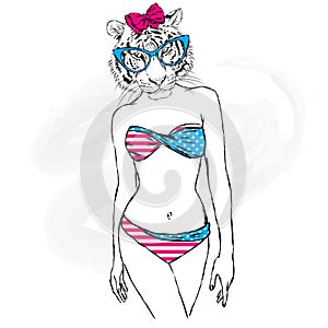 The tigress with the human body in a bathing suit. The girl with a beautiful body.