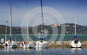 Tihany Abbey benedictine monastery view with sailing boats at Lake Balaton