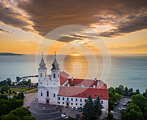 Tihany, Hungary - Aerial drone view of the famous Benedictine Monastery of Tihany Tihany Abbey with dramatic golden sky