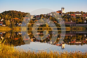 Tihany village and the abbey in suset colors with the inner lake and beautiful reflection on water at lake Balaton photo