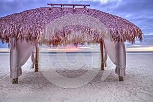 Tiki hut shelter on Tigertail Beach on Marco Island, Florida photo