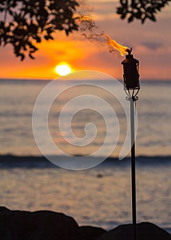 Tiki torch at sunset