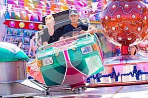 Tilburg, Netherlands - 2207.2019: people having a ride on break dance carousel in luna park, funfair called Kermis in Tilburg