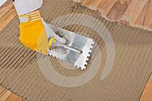 Tile adhesive notched trowel