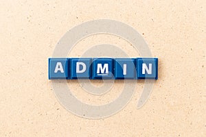 Tile letter in word admin on wood background