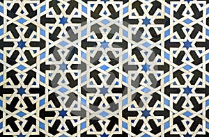 Tiles of Al Andalus. Alcazar of Seville Spain. Arab pattern decoration photo