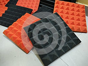 Tile panels of Sound proof sheets are placed in pile.