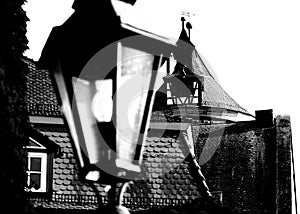 Tile roof from an older house and from an old watchtower in black and white