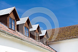 Tile roof and windows of mansard rooms