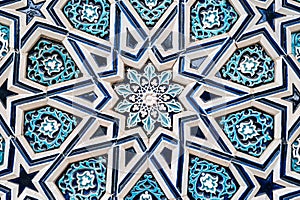 tile Uzbek mosaic with oriental Arabic Islamic pattern decorated with blue and white floral ornament with stars