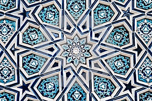 tile Uzbek mosaic with traditional oriental Arabic Islamic pattern decorated with blue and white starry floral ornament