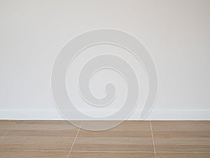 Tile wood floor pattern floor with white cement wall background