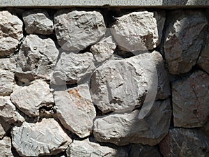 Tileable Stone wall texture seamless in half dark shadow