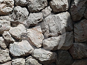 Tileable Stone wall texture seamless in half dark shadow