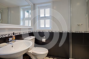 Tiled black and white shower room