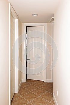 Tiled hallway with doors