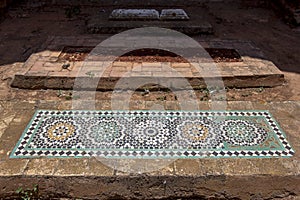 A tiled mosaic grave at Chellah in Morocco.