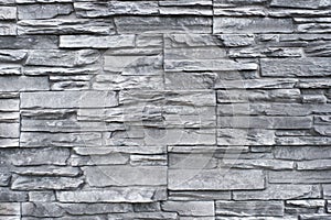 Tiled natural stone wall background - granite stone texture