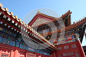 Tiled roof and facade decorated with a Chinese pattern. Palace in The Forbidden City, Beijing