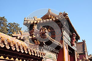 Tiled roof and facade decorated with a Chinese pattern. Palace in The Forbidden City, Beijing