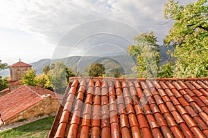 Tiled roofs of ancient Orthodox monastery in Alazani valley, Georgia. Nekresi monastery