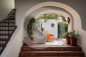 tiled staircase under a stucco archway