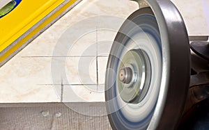 Tiler cutting tile angle grinder photo