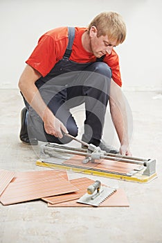 Tiler cutting tile at home renovation work