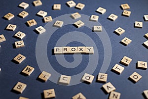 tiles arranged on a blue surface with the word Proxy highlighted among other letters