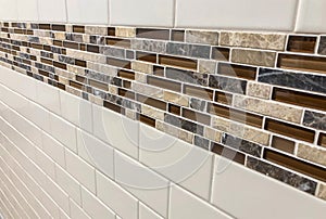 Tiles made of glass and stone installed on the wall as decoration or kitchen backsplash photo