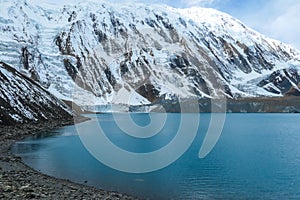 Tilicho Lake - A panoramic view on turquoise colored lake in Himalayas