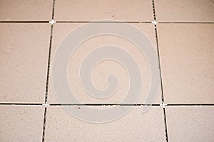 Tiling, tile trimming, metering and cutting. Repair of the floor