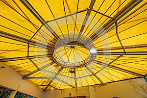 Tilt angle, Under a large outdoor yellow roof top tent with steel frame