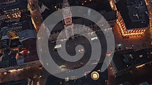 Tilt down revealing famous Marienplatz in Munich, Germany at Night from Aerial perspective