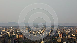 Tilt down to the horizon of the city of Qom, Iran