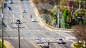 Tilt shift city intersection with cars driving