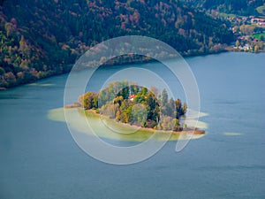 Tilt shift image of an island in the Schliersee lake in autumn