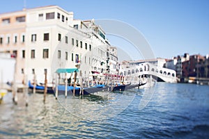 Tilt shift photo of view of Realto bridge in Venice with film effect. Soft focus