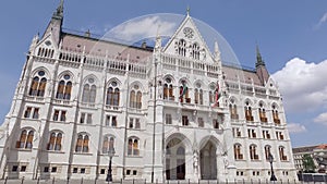 Tilt up panorama view from ground to Hungarian Parliament Building in sunny day, neo-gothic