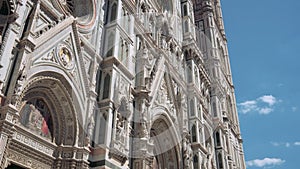 Tilt up of tourists in front of Cathedral of Saint Mary of the Flower, Florence, Italy