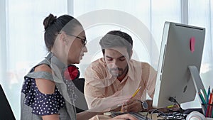 Tilt-up video shot of Business partners sitting and discussing in office