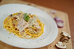 Tilted angle top view of spaghetti carbonara lunch dinner meal