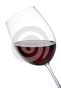 Tilted elegant glass of red wine