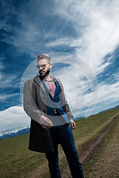 Tilted portrait of a serious looking man walking