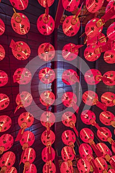 Tilted view of Chinese red lanterns in temple