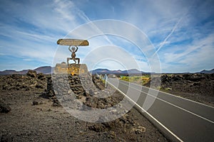 View on the El Diablo entrance sign and road of Timanfaya National Park on Lanzarote, Canary Islands