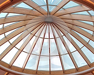 Timber beams of a roof forming a circular skylight