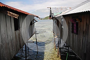 Timber buildings with piles at sea coast